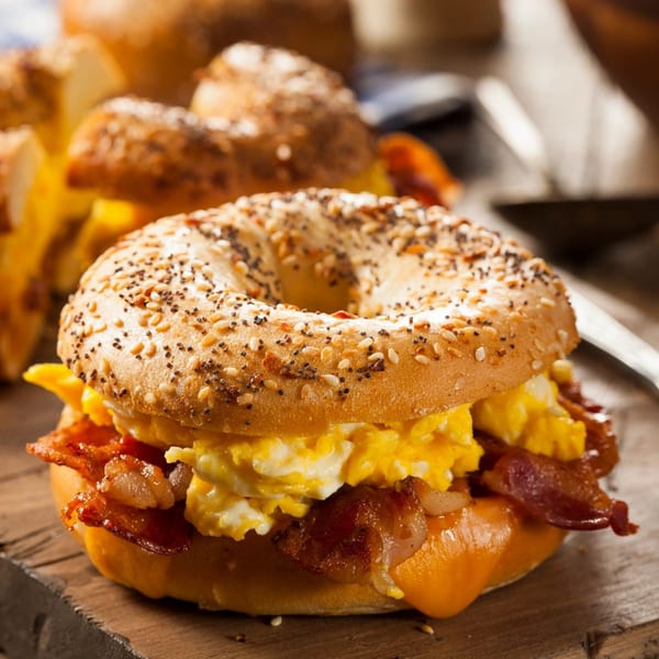 New York Bagel Company's everything bagel with scrambled eggs, crispy bacon, and melted cheese.