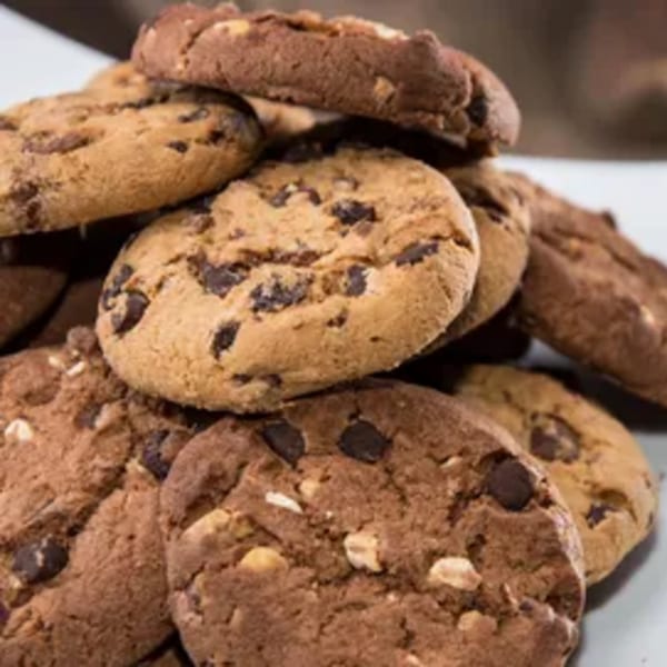 A close-up of a pile of chocolate chip and double chocolate chip cookies.